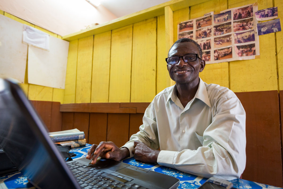 Translator working at his computer in an office setting